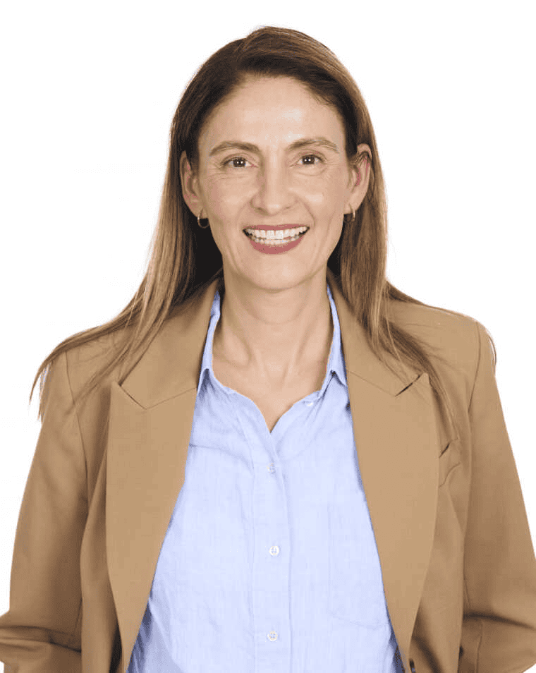 Professional businesswoman smiling, wearing a beige blazer and blue shirt, representing leadership and confidence. Perfect for corporate, professional, and business-themed content.