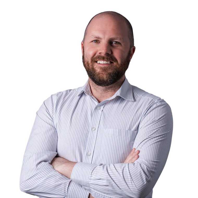 Professional man smiling in a business portrait for CMEWA, representing leadership and expertise in the electrical work industry.