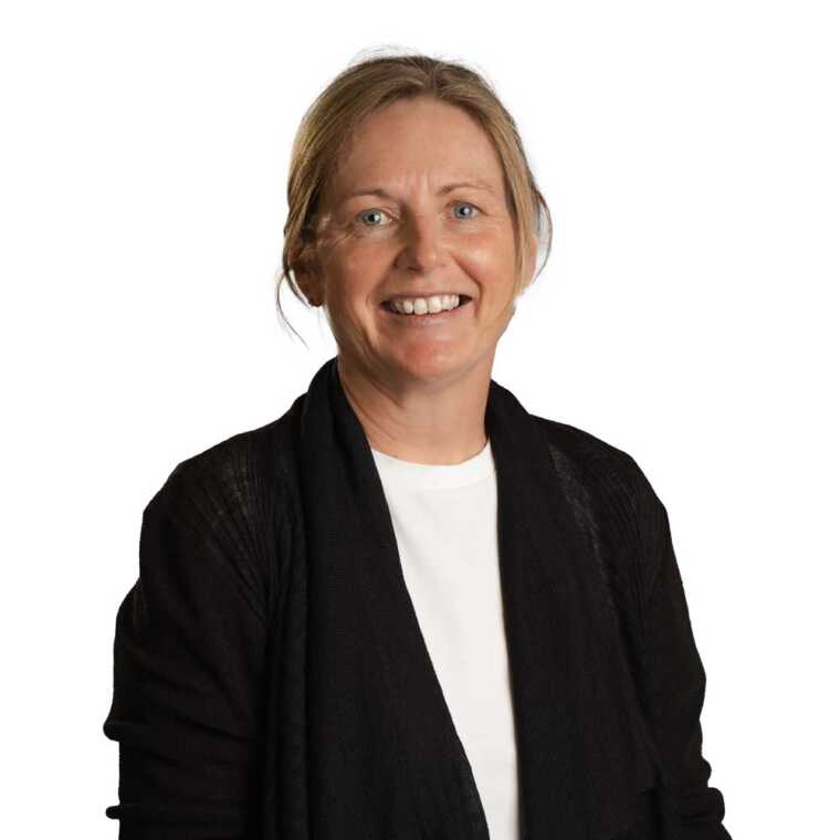 CMEWA woman professional smiling, businesswoman, office attire, leadership, community development.