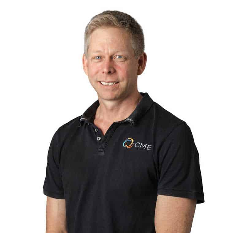 Professional man wearing CMEWA branded polo shirt for construction and engineering industry.