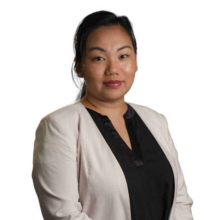 Professional woman in business attire representing CMEWA organization and leadership for women's empowerment and professional development.
