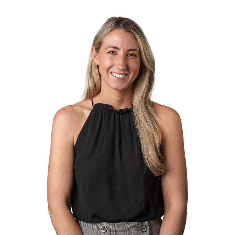 Professional woman smiling in black sleeveless blouse for business or corporate profile images.