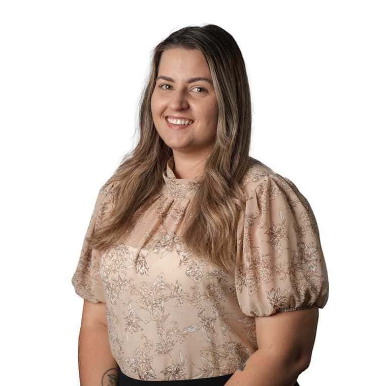 Professional woman smiling in business casual attire for CMEWA branding and corporate image.