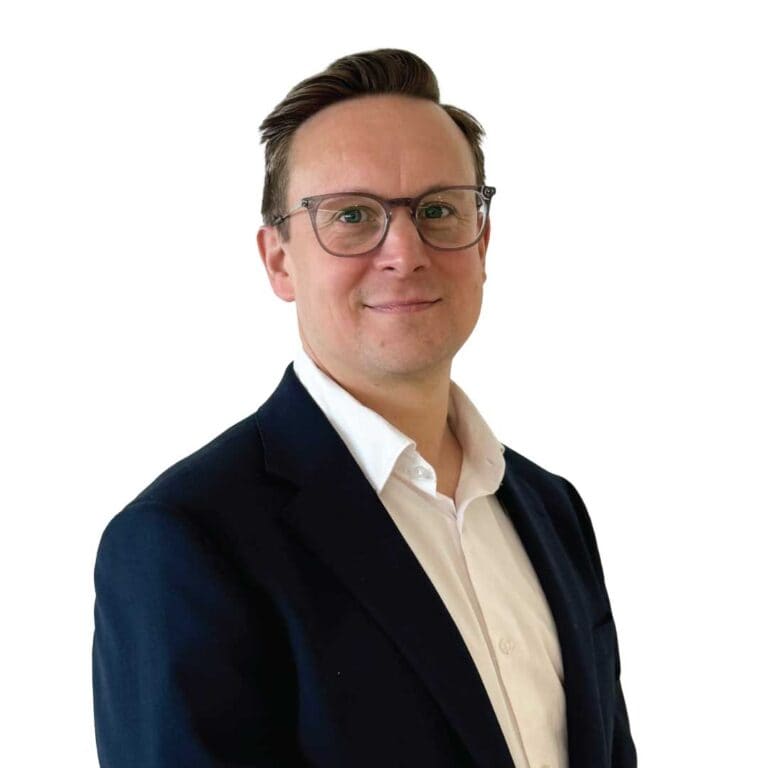 Professional man in business suit and glasses smiling portrait for CMEWA SEO image optimization.