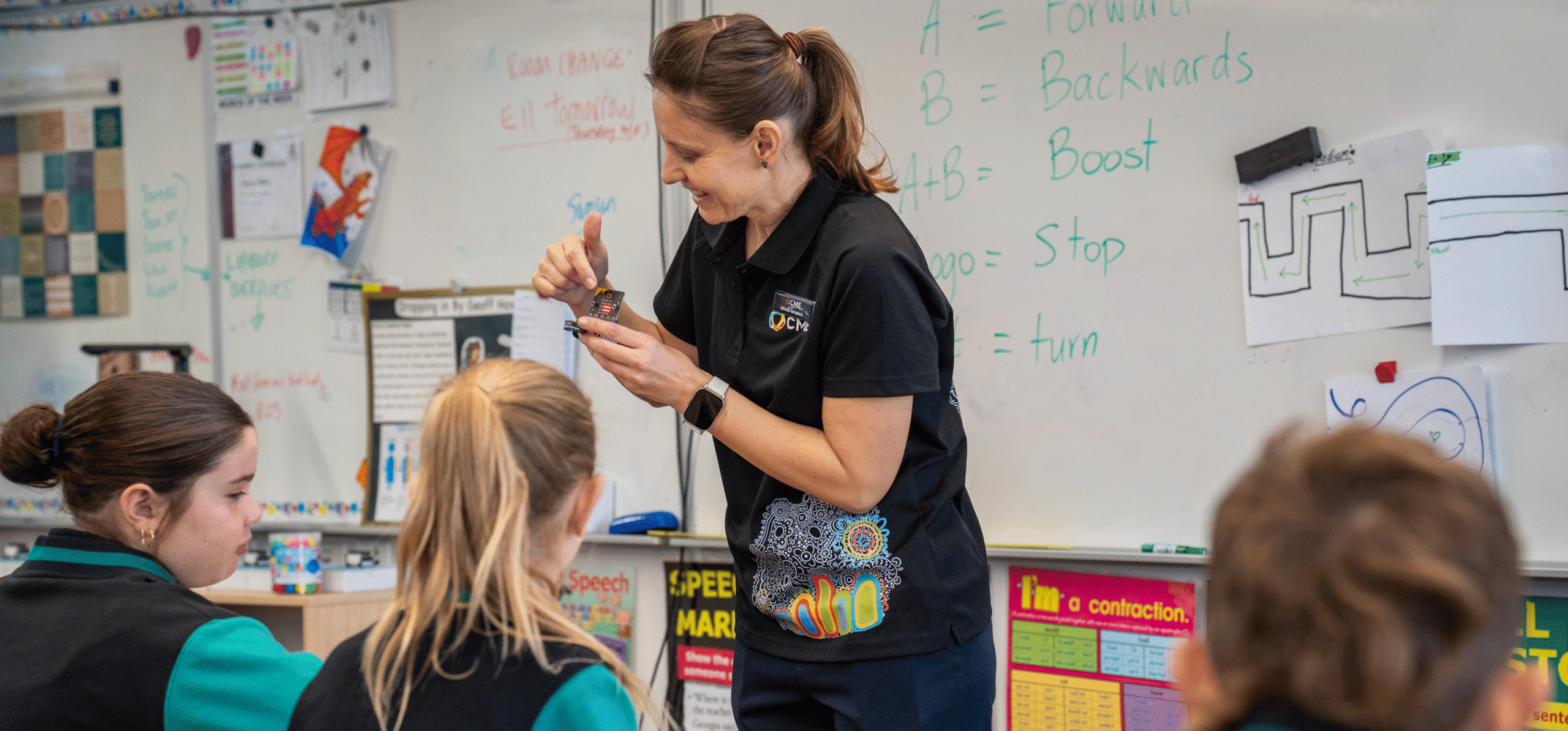 Cmewa-educator-teaching-students-using-multimeter-in-classroom.jpg.
